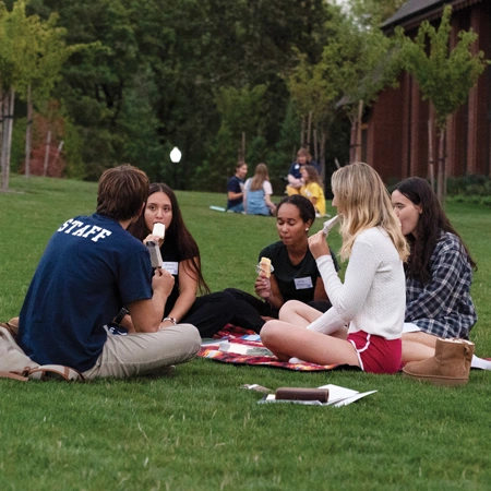 students having a picnic on campus