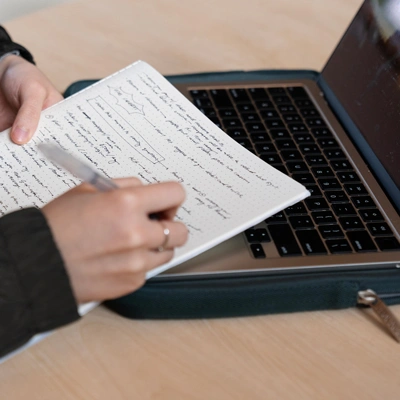 student writing notes for their George Fox Digital class