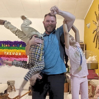 Trevor Owen playing with children on a mission