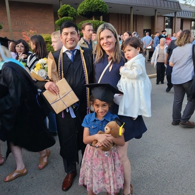 Rodriguez at his commencement ceremony with his wife and kids