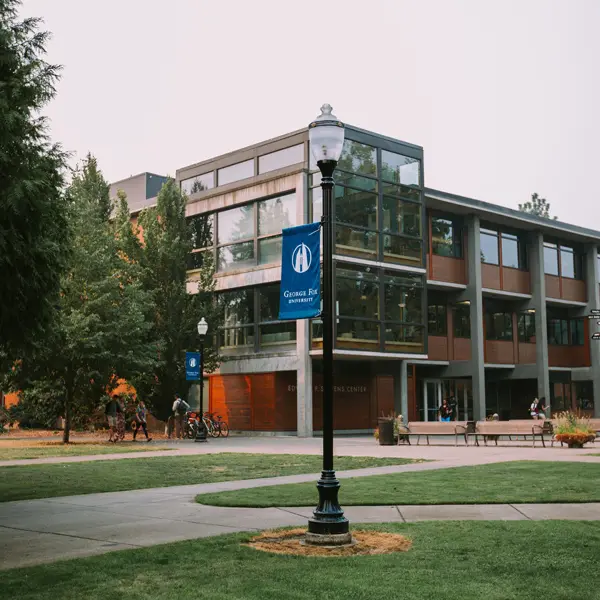 Campus quad featuring a lamp post in front of Stevens Building