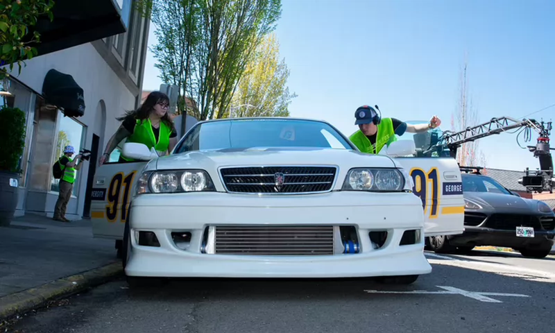 Maia and a classmate preparing the drift car between takes