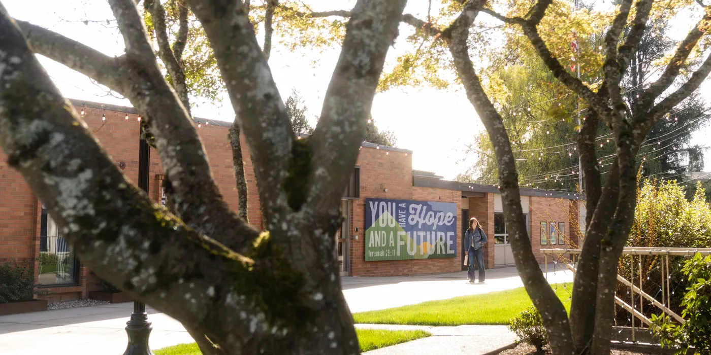 two students walk across the quad