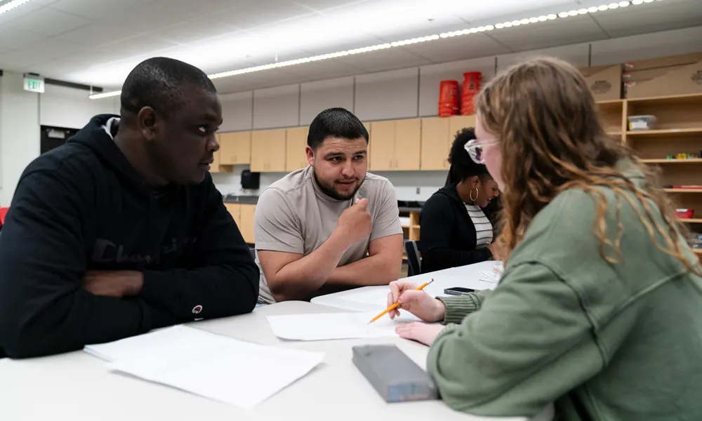 Emmy works with two ESOL learners in her class