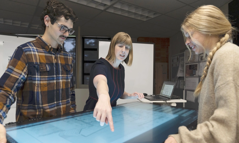 Caleb working with professor Casey Martin on a design project