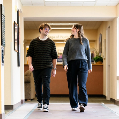 Connor walking with another student