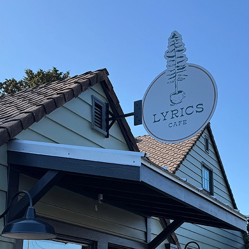 Lyrics coffee shop entrance along with signboard that reads Lyrics cafe