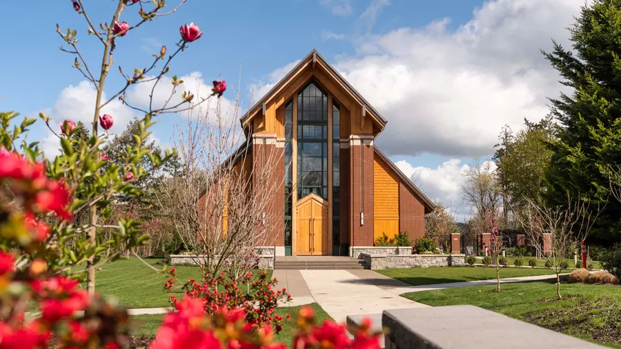 The George Fox chapel framed by spring flowers