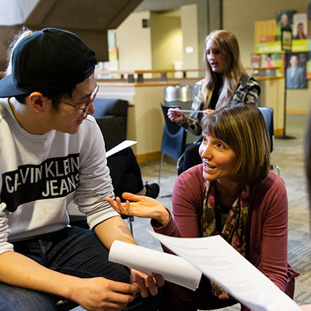 A student talking with a professor