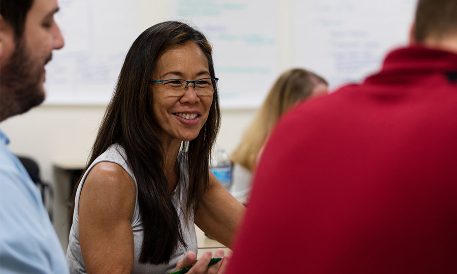 A group of students engaging in talks during class