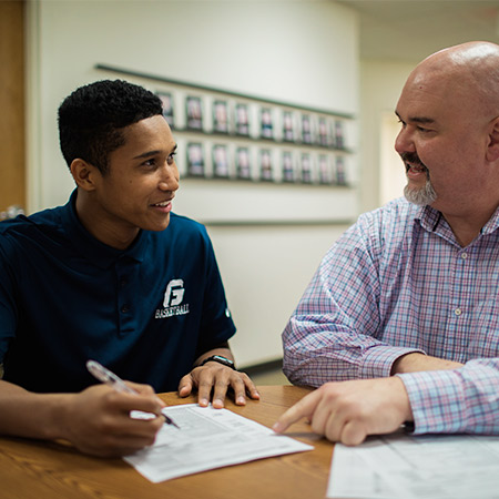 A student talking with a mentor