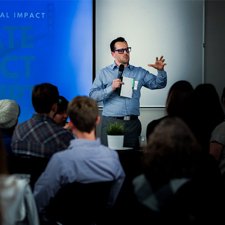 A business professional giving a presentation to the audience