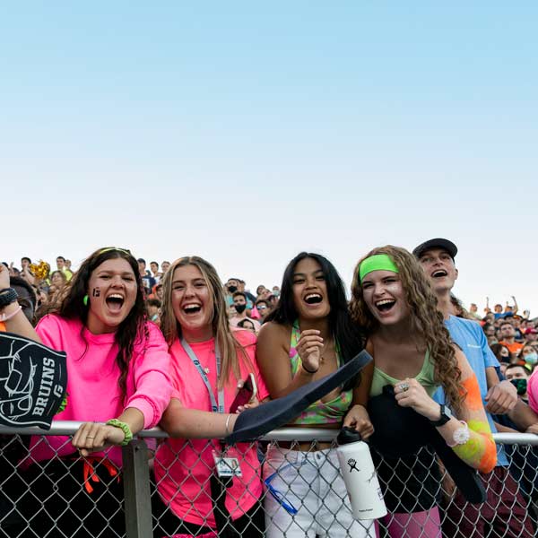 Students smile at campus event