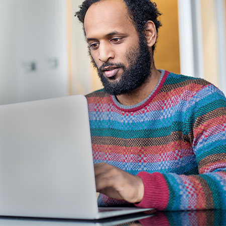 A male professional with a laptop