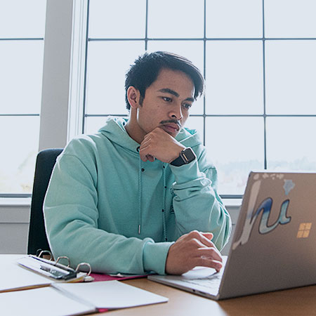 A male professional with a laptop