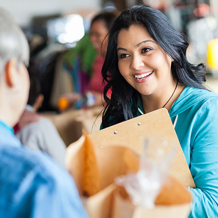 A professional woman interacting with other person at workplace 