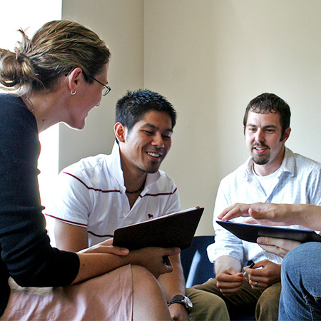 A group of people having discussions led by a leader 