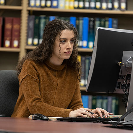 A female professional working on a computer