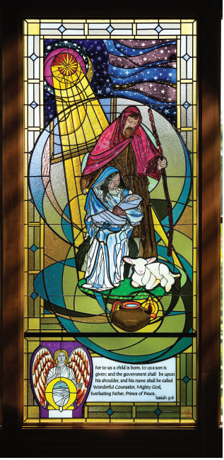 Stained glass window depicting the Messianic prophecy of the child born, illustrating Isaiah 9:6