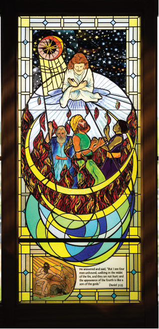 Stained glass window depicting three men protected in the fiery furnace, illustrating Daniel 3:25