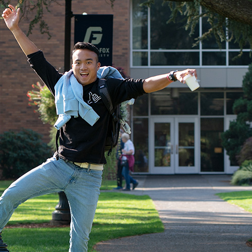 College student on a laptop computer outdoors