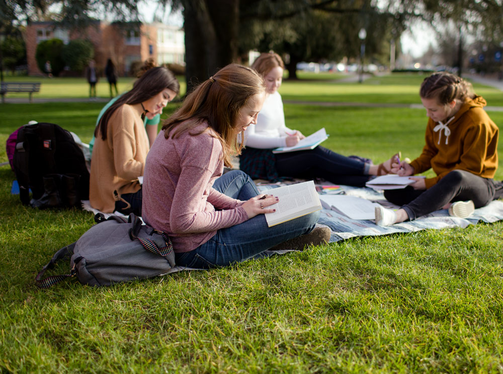 students outdoors studying