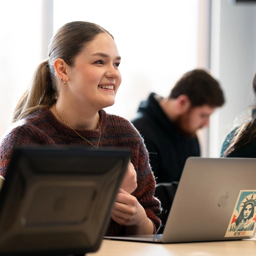 student smiling in class