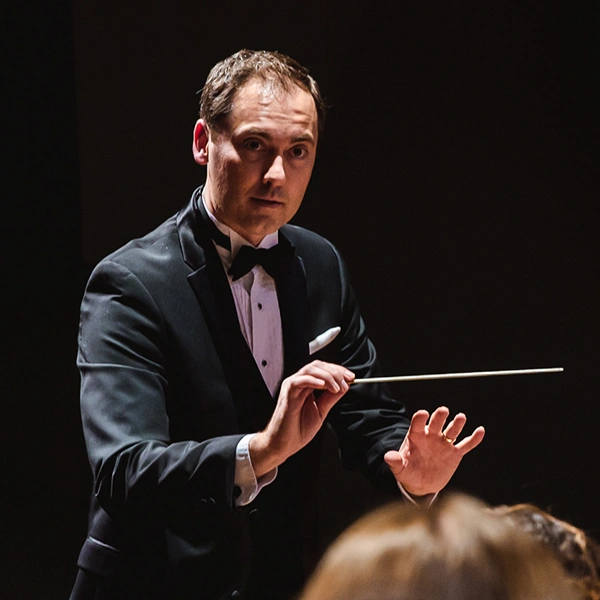 Professor of Instrumental Music Dwayne Corbin conducts students in a concert