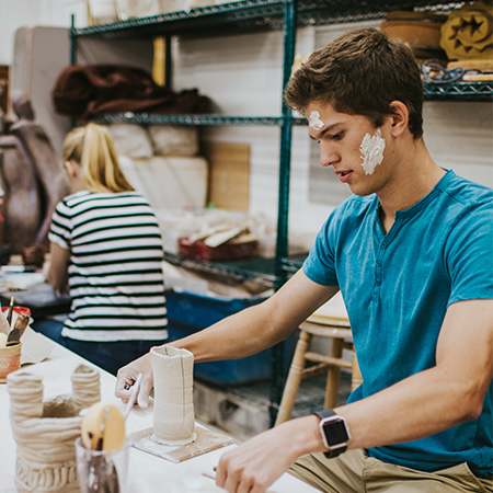 students working in the ceramics studio