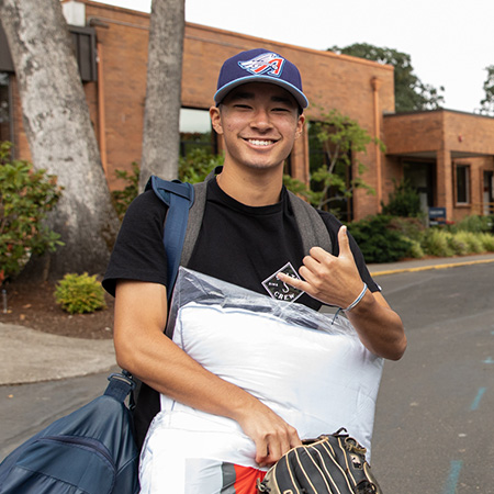 A student moving into his new dorm