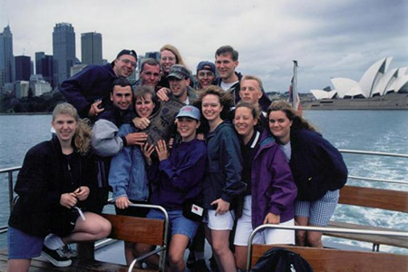 George Fox students pose for a group photo in front of a landscape in Australia