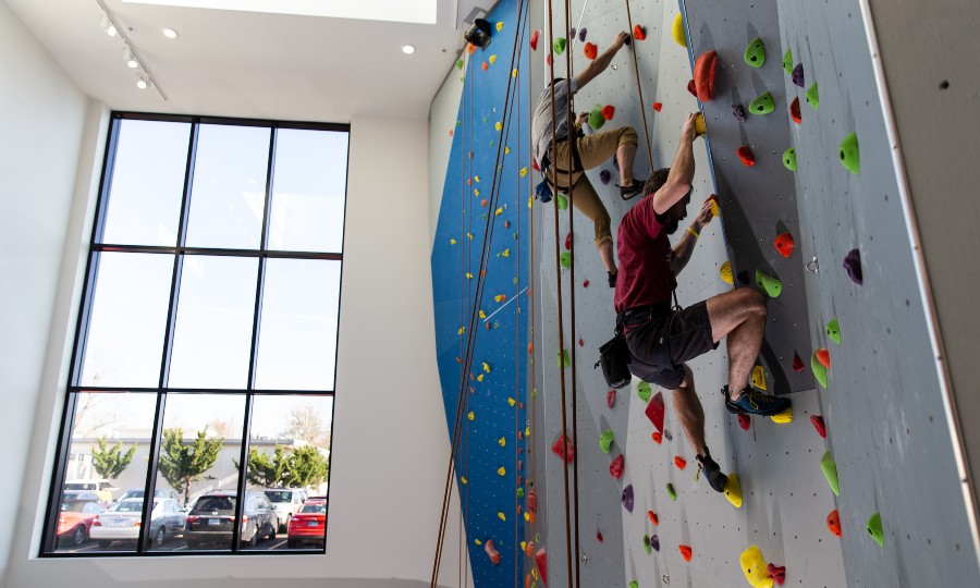 Two people on an indoor climbing wall