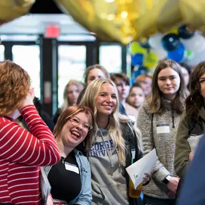 A cluster of students standing together excited about Bruin Preview