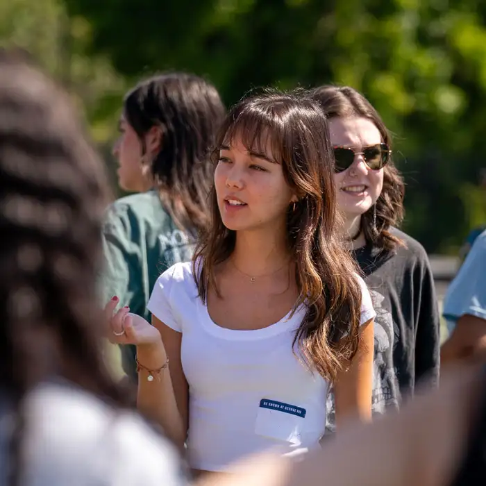 Student interacting with other students at Bruin Preview event