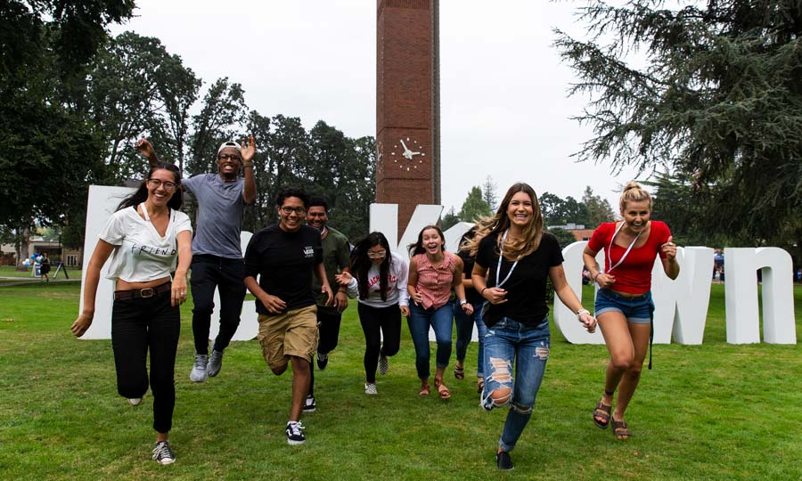 Students running towards the camera