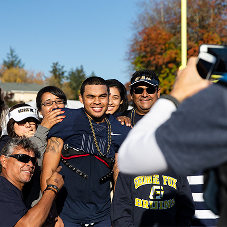 A student athlete is visiting George Fox campus with family.