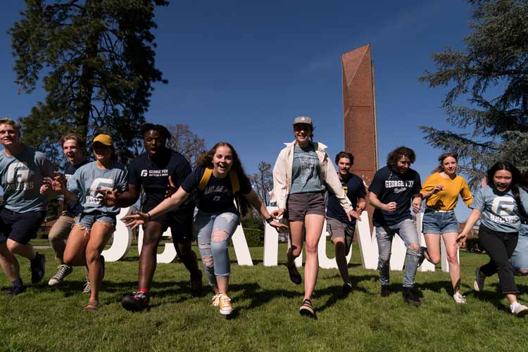 Students run towards camera