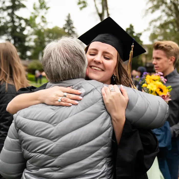 Graduate embracing her grandma after the commencement ceremony