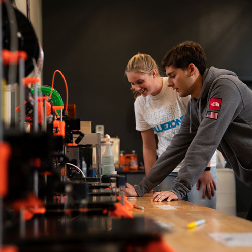 2 students work on tech in the maker hub