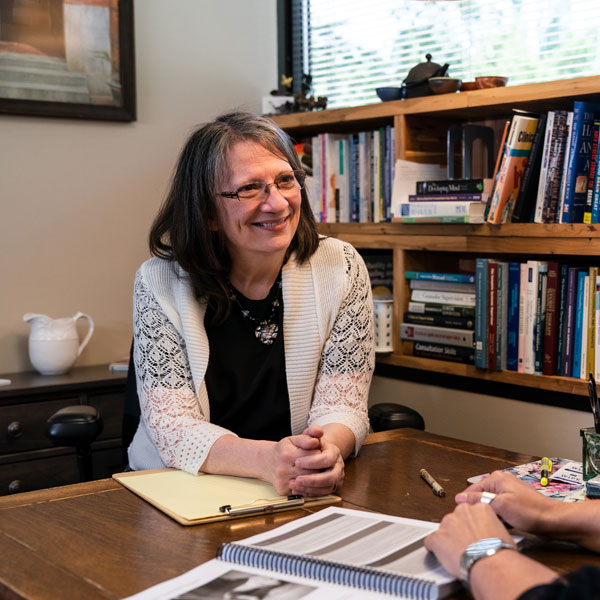 principal talking with teacher in an office