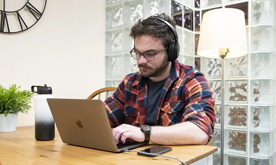 A student working on his laptop