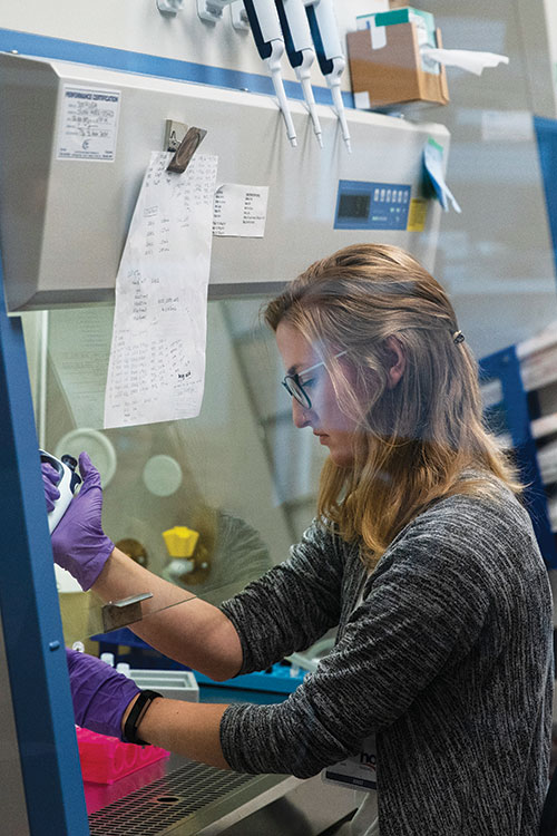 Recent graduates Quinlan Morrow and Brittany Smith seek and serve God in the microscopic territory of human cancer cells