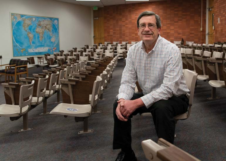 Mark Weinert sitting in Caulder lecture hall