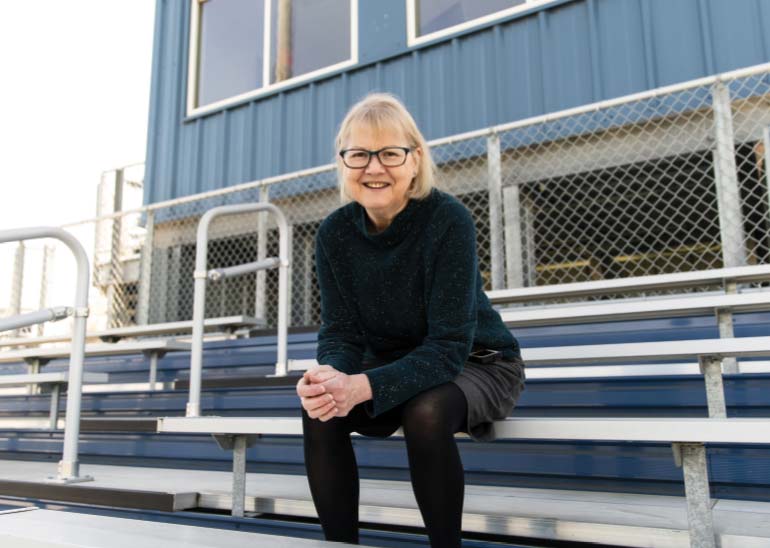 Deb Worden sitting in the baseball stadium