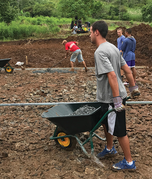 Men's Basketball team builds court in Panama