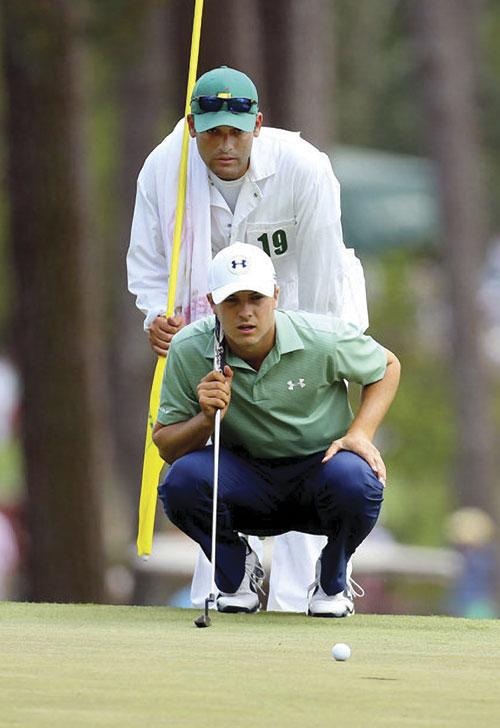 Michael Greller caddying for Jordan Spieth