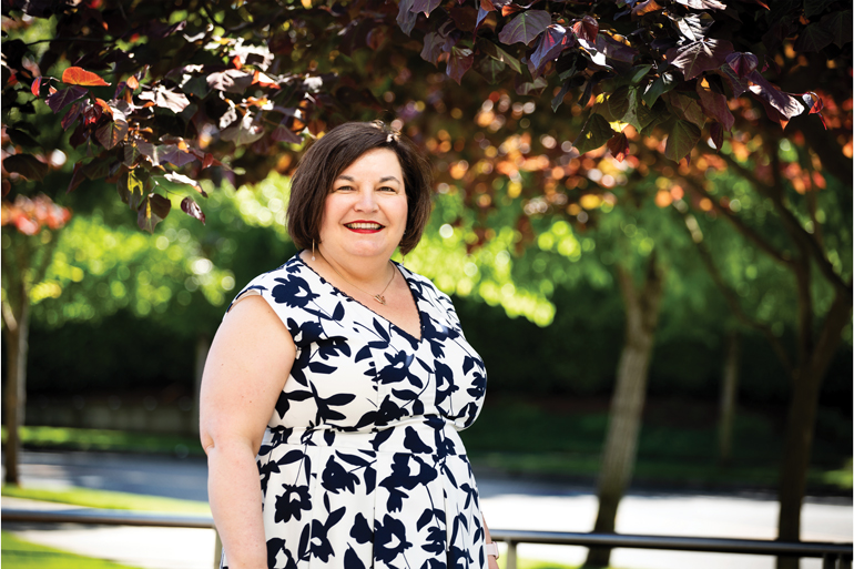 Robin Henderson infront of a tree