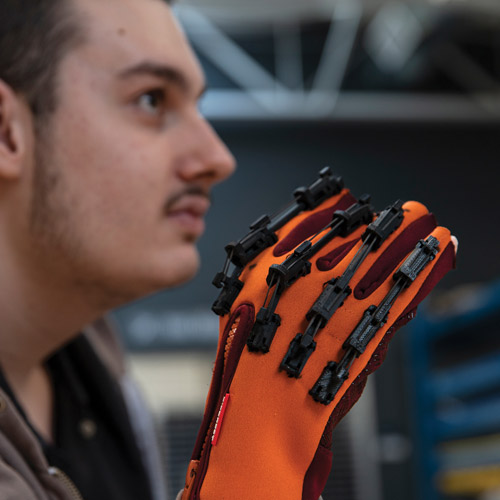 Brandon wears the orange gauntlet (glove)