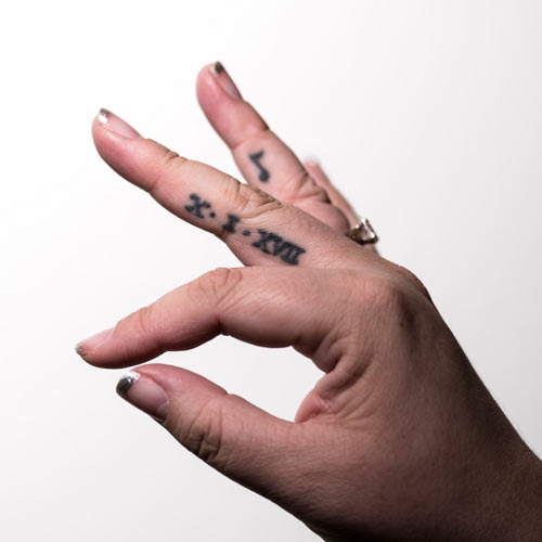 image of Marchelle's finger tattoo