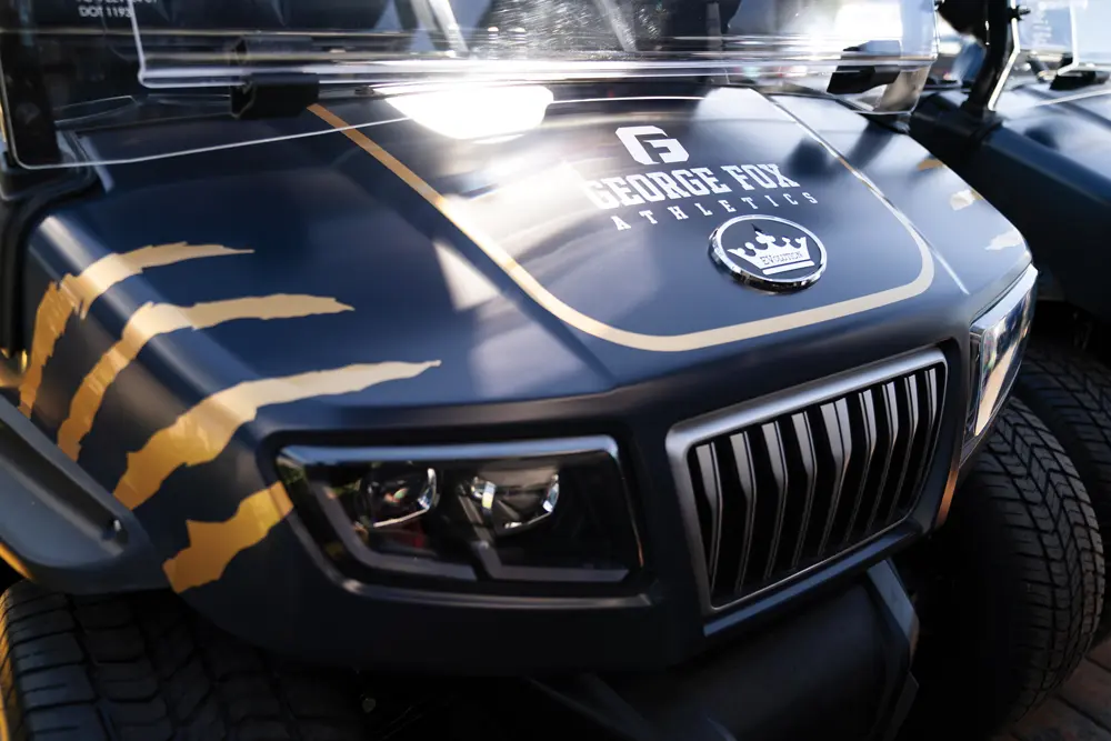 The hood of one of George Fox's new Guild golf carts